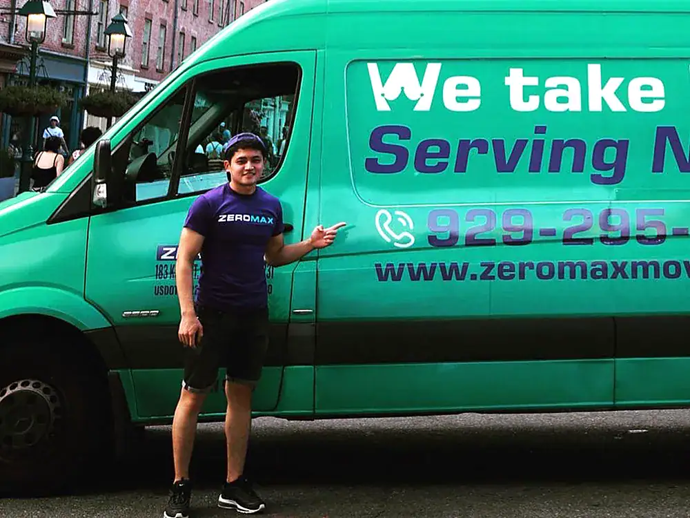 ZeroMax mover standing beside a branded moving van for a move from NYC to Austin