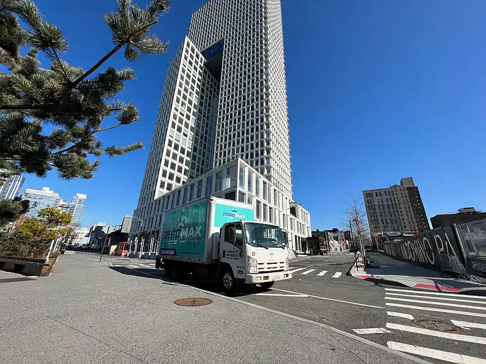 ZeroMax moving truck on a street lined with high-rise towers for a move from NYC to Boston