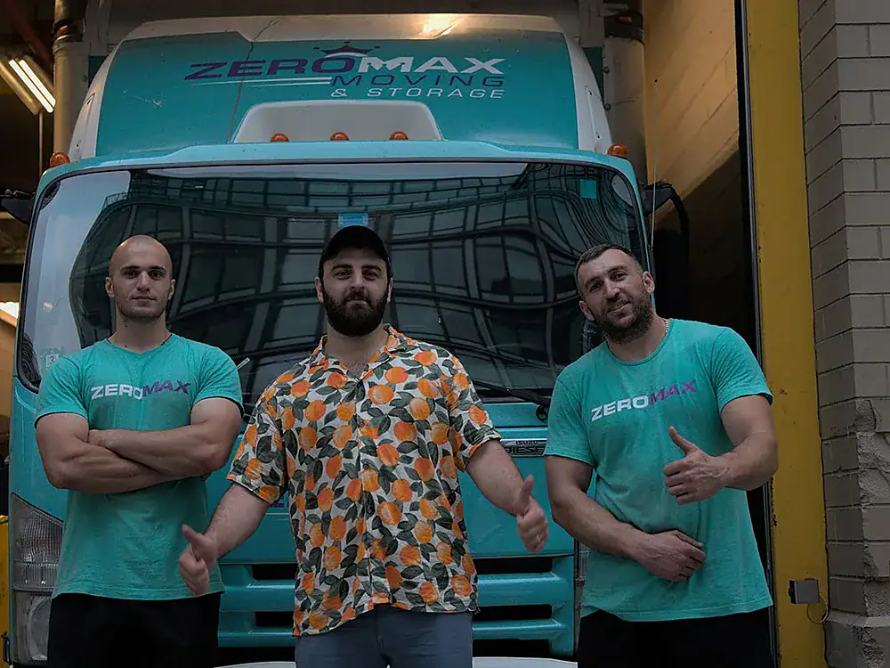 ZeroMax moving crew standing in front of a company truck for a move from NYC to Los Angeles