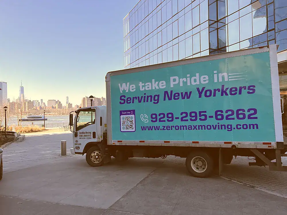ZeroMax moving truck on the waterfront with the Manhattan skyline behind it for a move from NYC to Philadelphia