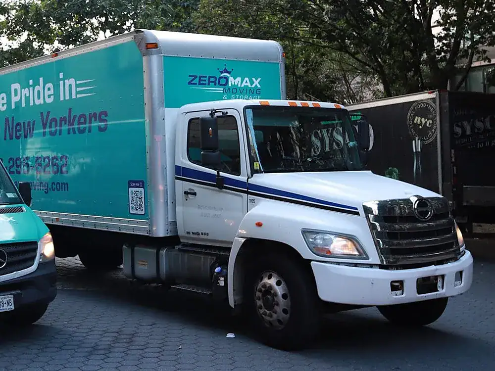 ZeroMax box truck parked on a city street for a move from NYC to San Antonio