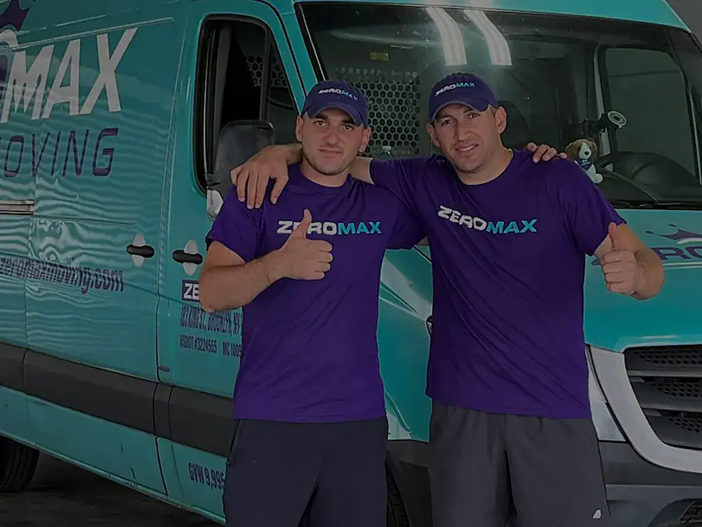 Two ZeroMax movers in front of a moving van for a move from NYC to San Francisco