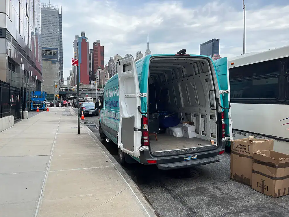 ZeroMax moving van being loaded with boxes on a Manhattan street for a move from NYC to Washington, D.C.