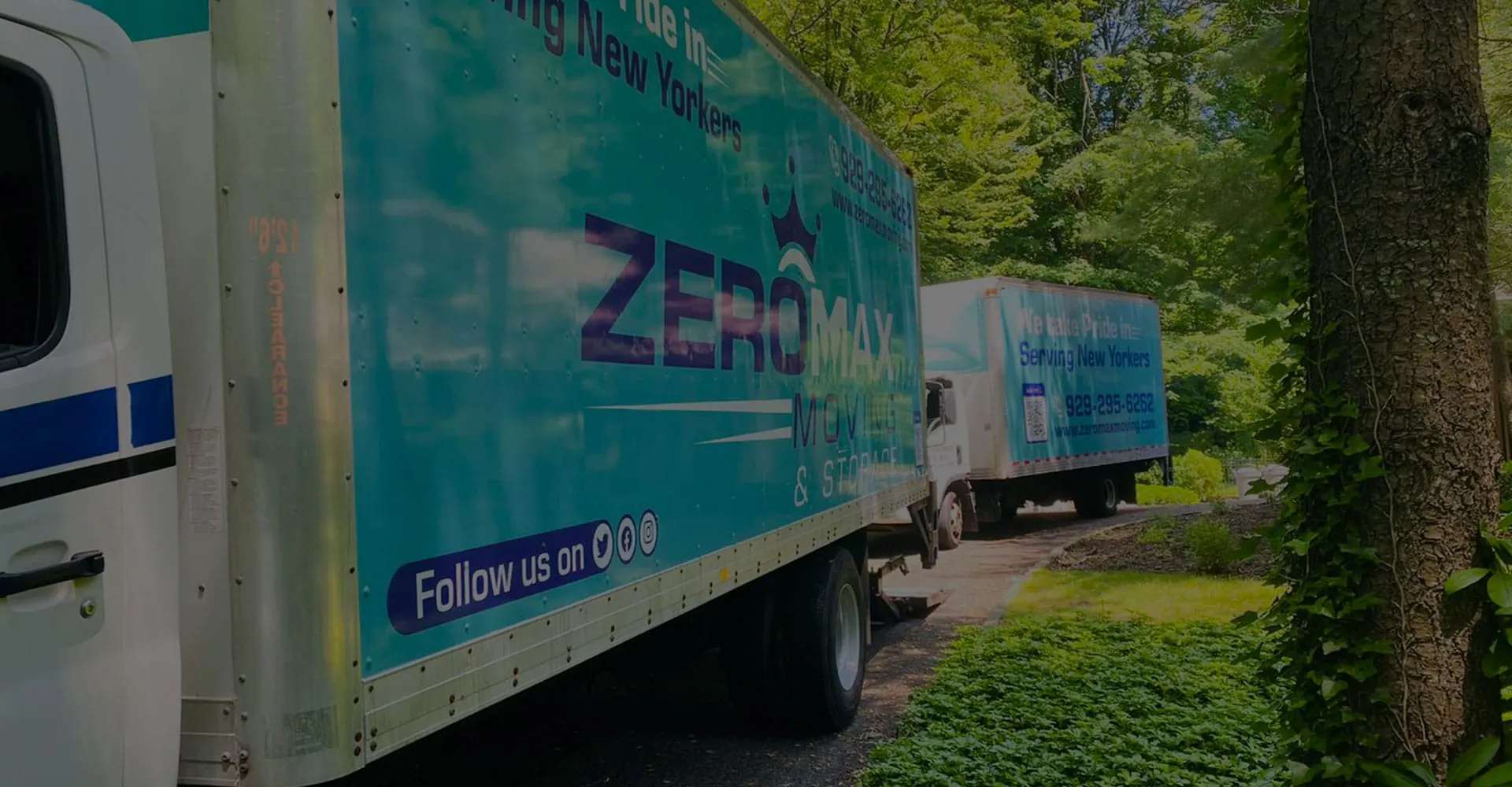 ZeroMax moving trucks parked outside a customer building